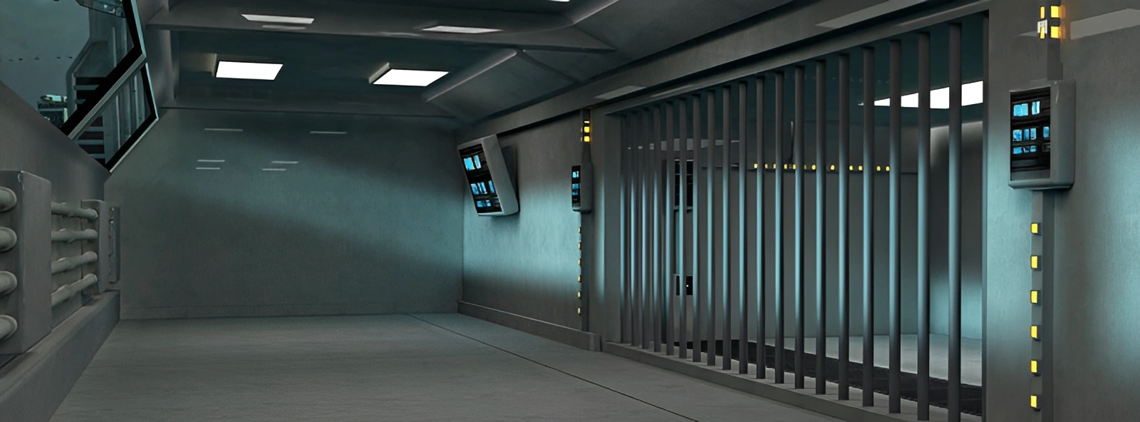 Long hallway with a lot of lights on the ceiling, a floor, walls, screens, and a railing
