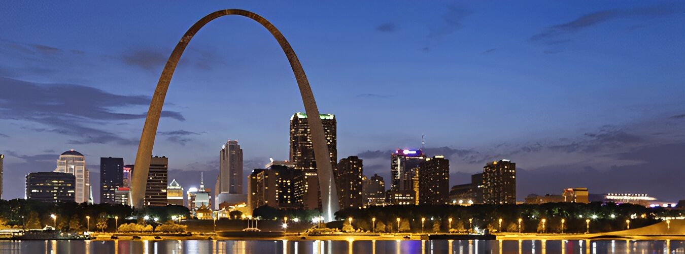 Skyline at night, with the iconic standing tall in the foreground