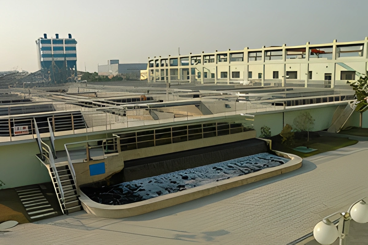 Large building with a pool in the middle of it, surrounded by plants, trees, and lights